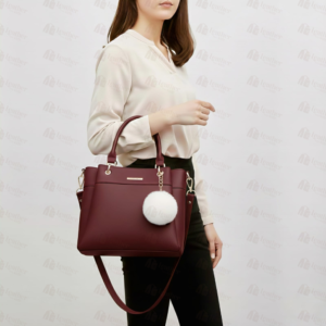 Burgundy leather handbag with white pom pom charm – Leather and Kid