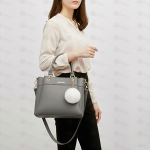 Grey leather tote bag with white pom pom charm – Leather and Kid