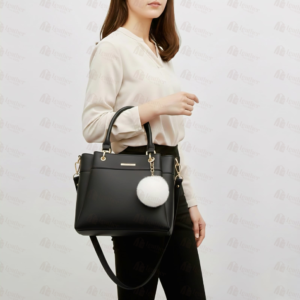 Black leather handbag with white fur pom pom charm – Leather and Kid