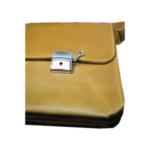 Leather and Kids mustard leather bag close-up of silver lock clasp with key