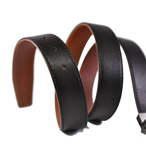 Men's black leather belt strap coiled to show pebbled grain, stitched edges, punched holes and a tan brown underside on a white background