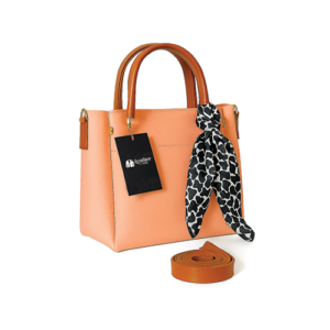 Leather and Kids peach leather tote bag with tan handles and printed scarf accent