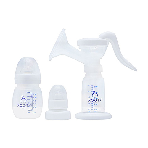 Leather and Kids Roots white manual breast pump with bottle and spare parts